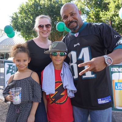 An Eagles West family in their green on gameday